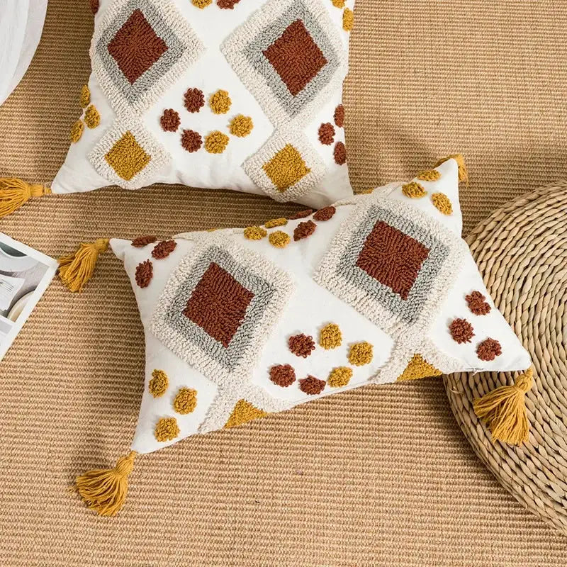 White rectangular pillow cover with boho loop tufted geometric patterns in brown and mustard yellow yarns by decorbites boho loop