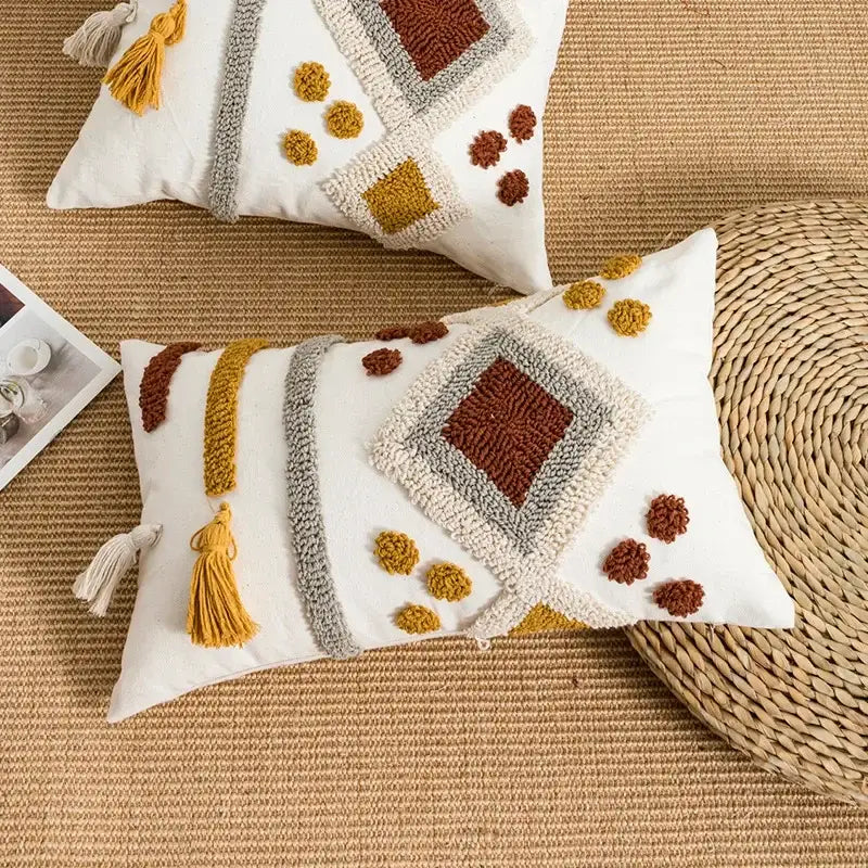 White rectangular pillow cover with boho loop tufted geometric embroidery in earthy tones by decorbites boho loop