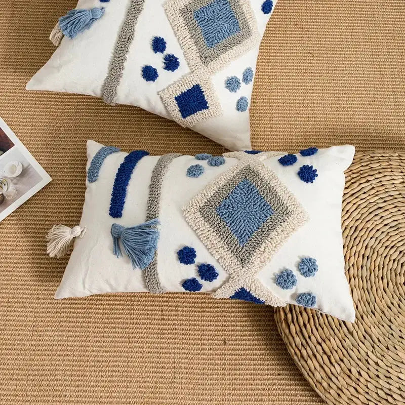 White rectangular boho loop tufted pillow cover with blue gray geometric embroidery and tassels for decorbites decor
