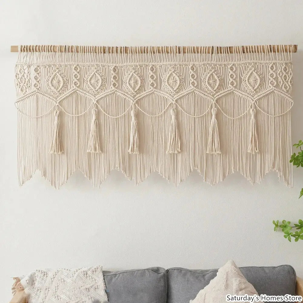 Cream-colored boho macrame door curtain made of cotton with intricate geometric patterns and dangling tassels for decorbites boho macrame