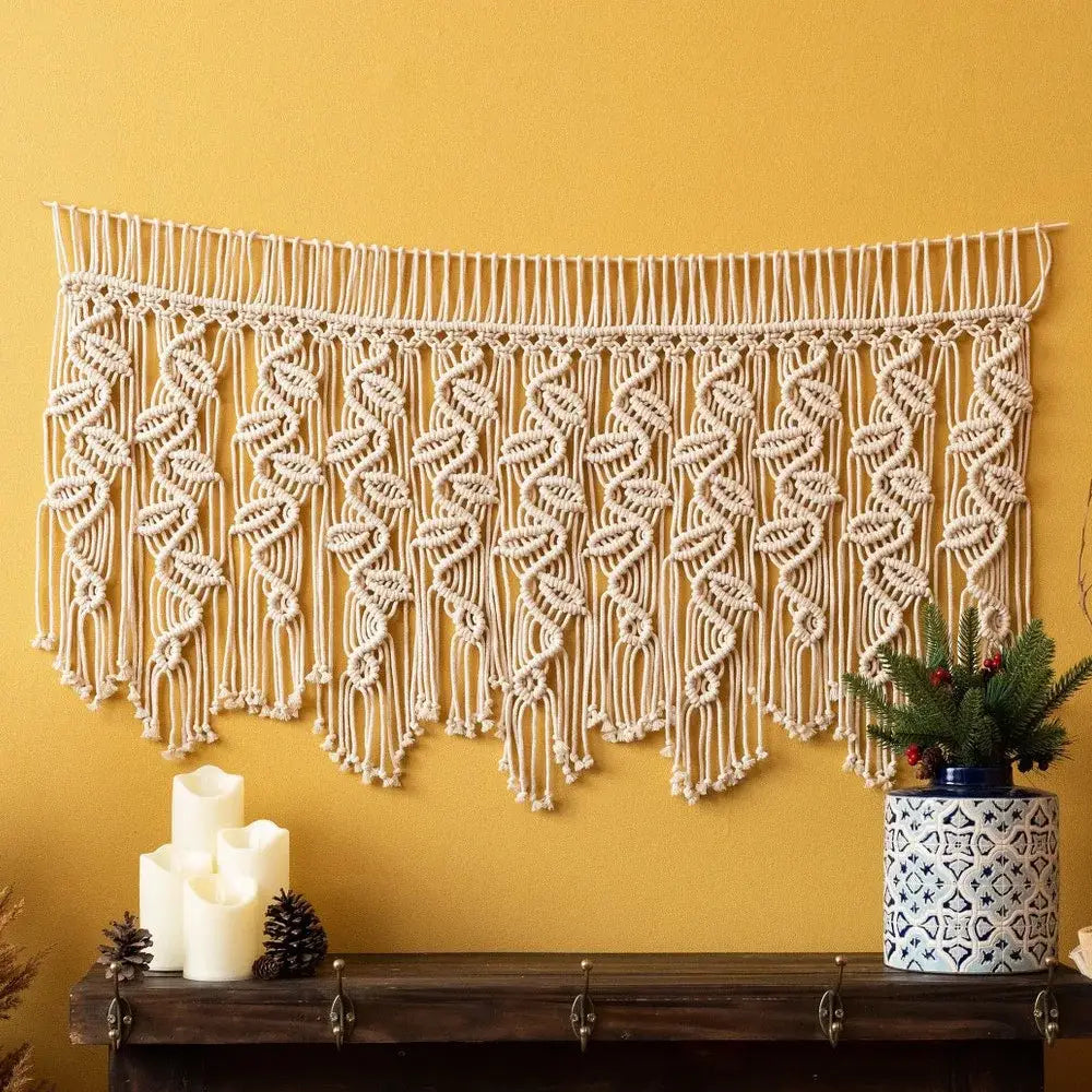 Cream-colored boho macrame tapestry curtain with intricate leaf and wave patterns for bedroom decor by decorbites boho macrame