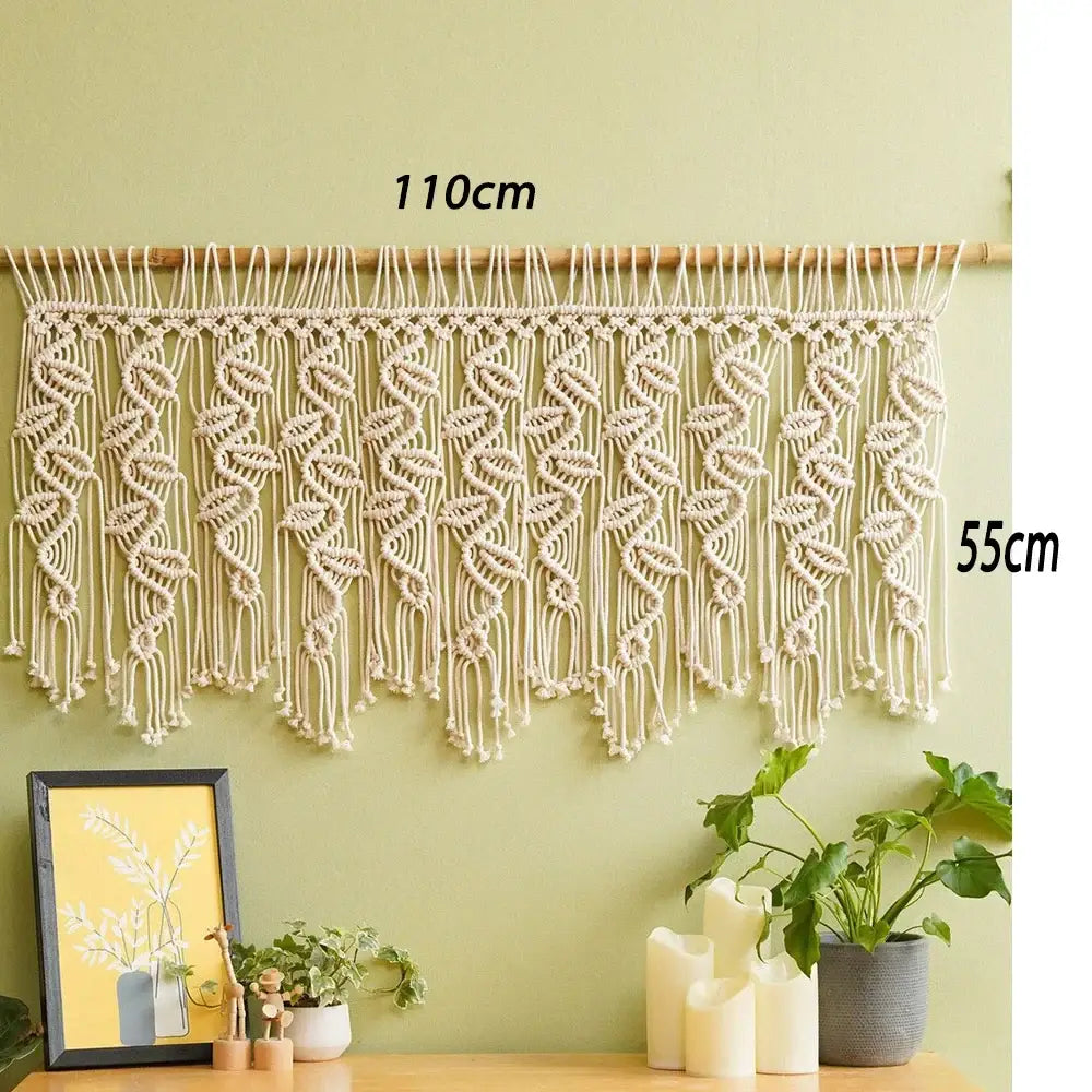 Cream-colored boho macrame tapestry curtain with leaf and swirl patterns on wooden rod decorbites boho macrame decor