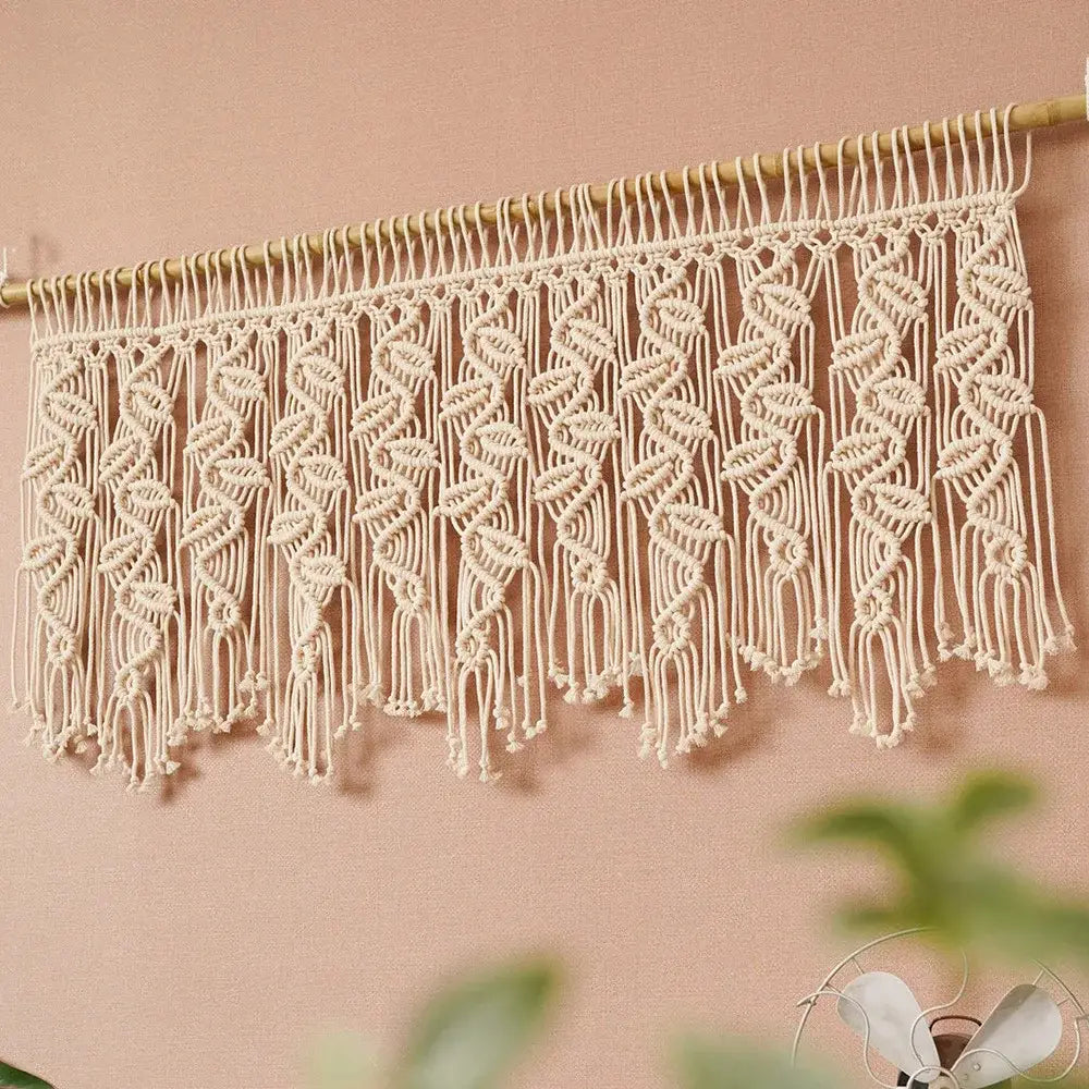 Cream-colored boho macrame tapestry curtain with intricate leaf pattern and dangling fringe for bedroom decorbites decor