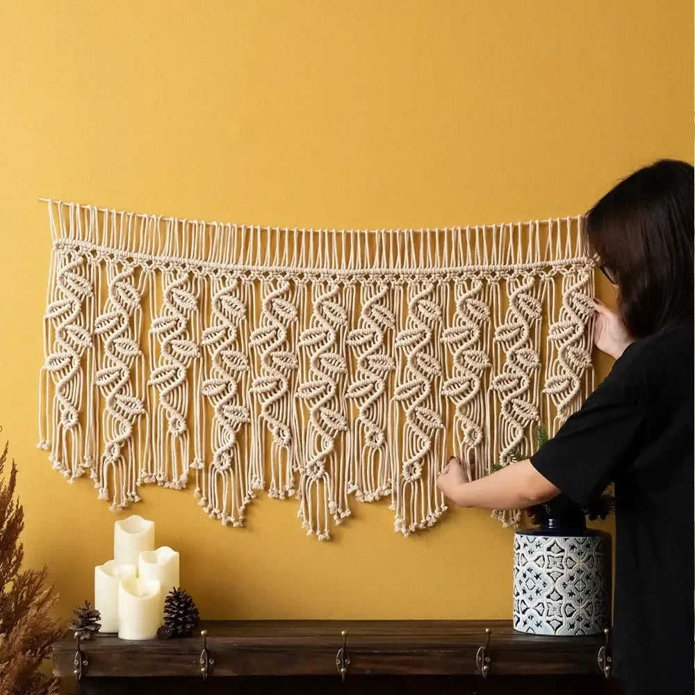 Beige boho macrame tapestry curtain with intricate cream leaf pattern and dangling fringe for bedroom decorbites decor