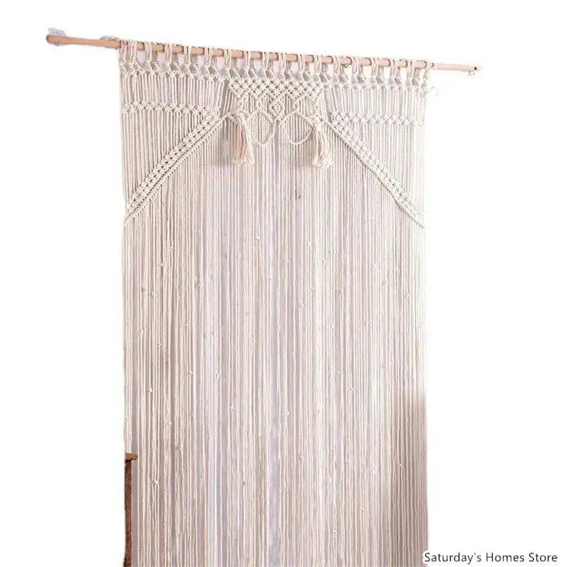Cream-colored decorbites boho macrame tassel curtain tapestry with intricate woven patterns and tassels hanging on wood rod