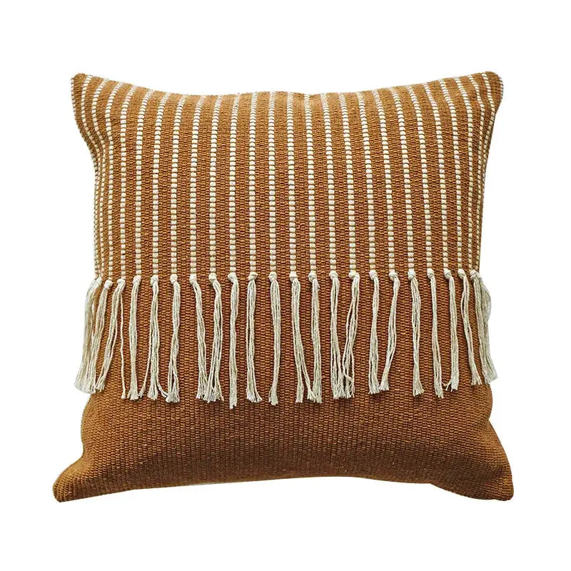 A square earthy brown woven boho moroccan fringed pillowcase with cream vertical stripes and tassel fringe decorbites living room decor
