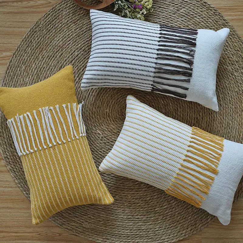 Three rectangular woven boho moroccan fringed pillowcases in mustard yellow black and white for earthy tones decorbites living room