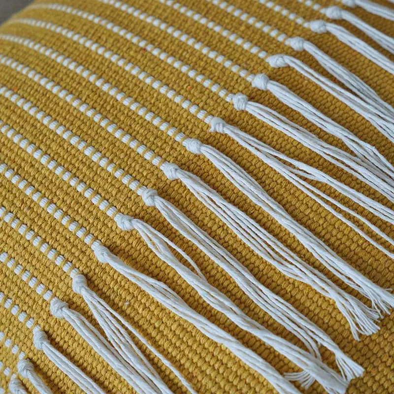 Mustard yellow woven boho moroccan fringed pillowcase with white tassels for earthy tones living room decorbites decor