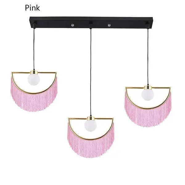 Pink fringe glass ball pendant light with gold-toned frames and white bulbs for boho bedroom decor