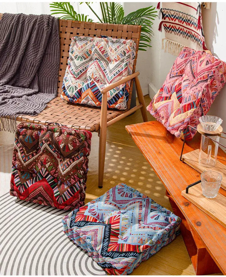 Boho multi color patterned fabric square floor pillows in vibrant reds blues and earth tones for living room seating