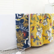 Two patterned boho navy and yellow cotton bath towels with floral and giraffe motifs ideal for bathroom decorbites cotton bath use