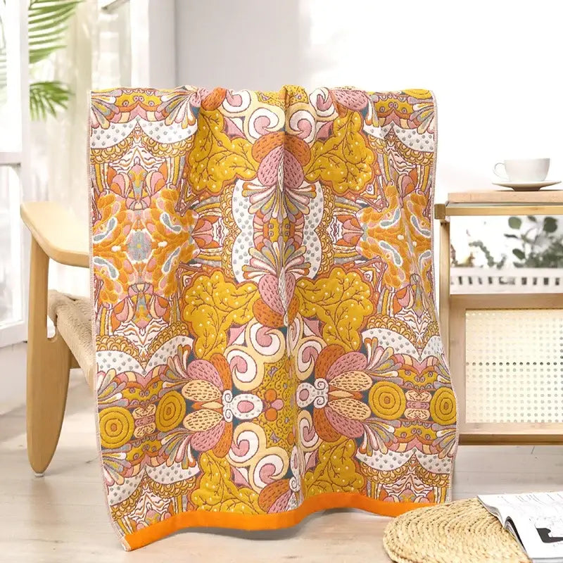 A boho navy and yellow cotton bath towel with a vibrant psychedelic floral design for bathroom decorbites cotton bath use