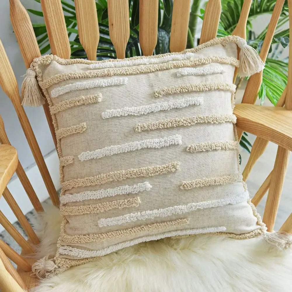 Beige cotton pillow case with cream textured stripes and tassels by decorbites boho nordic for bedroom decor