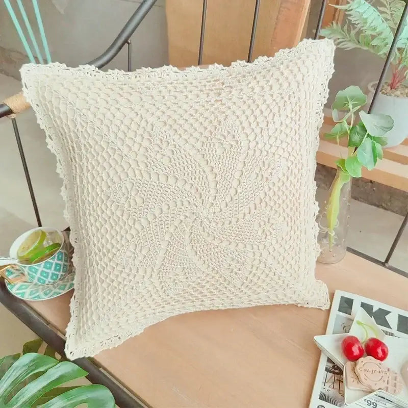 Cream-colored boho crochet cushion cover with intricate lace pattern and fringed edges for living room decorbites style