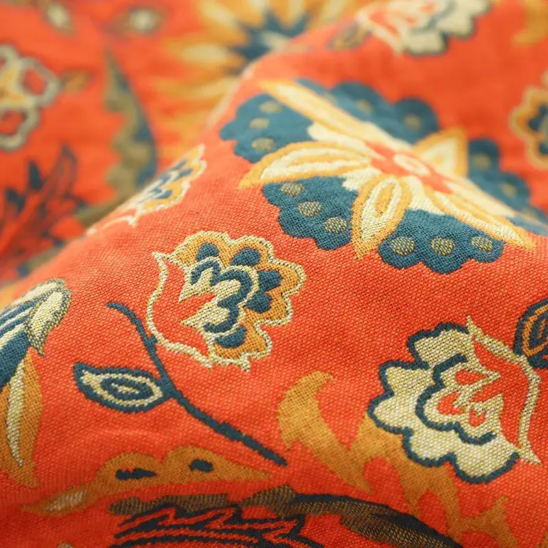 Boho orange and teal floral gauze towel blanket featuring intricate embroidered patterns for decorbites gauze boho style