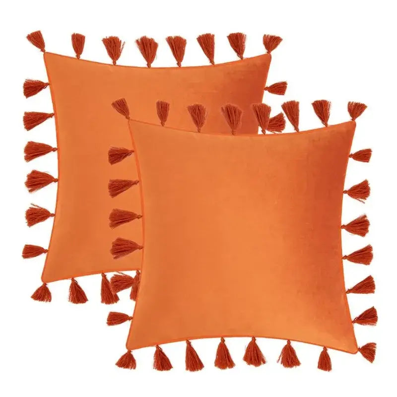 Boho orange velvet tassel fringe pillow covers with rust-colored tassels for stylish living room home decor