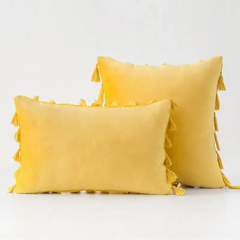 Yellow velvet velvet throw pillow covers with tassel fringe edges for boho home decor living room accents