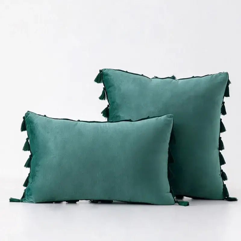 Teal velvet throw pillow covers with black tassel fringe for boho home decor living room accents