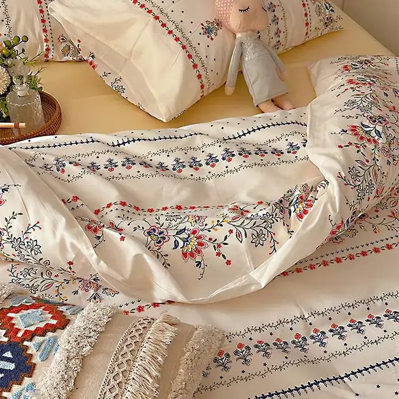 Cream satin duvet cover with intricate red blue and black floral embroidery in decorbites boho pattern printed bedding set