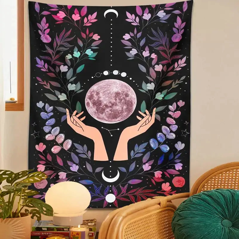 A vibrant black boho pink botanical moon tapestry featuring a pinkish-purple moon with floral and celestial details