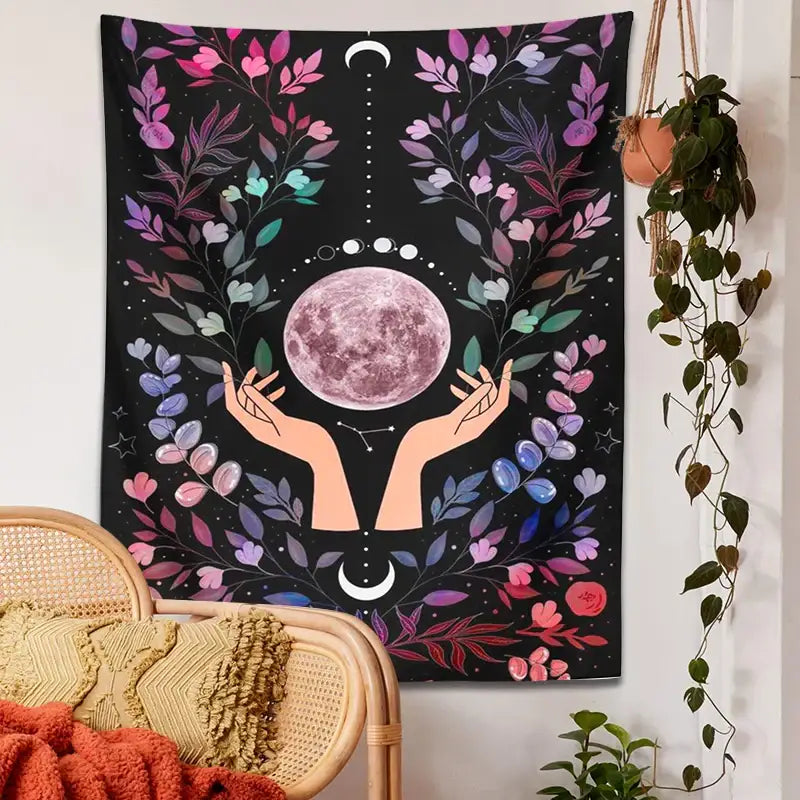 A vibrant black botanical moon tapestry with a pink moon and floral motifs for boho bedroom wall art