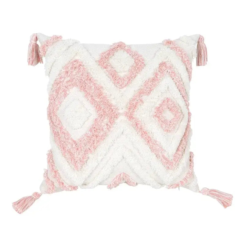 A cozy boho pink geometric textured pillow cover with white and pink colors and soft tassels for bedroom decorbites decor