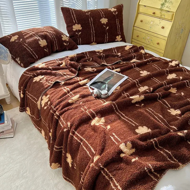 Brown plush boho printed blanket with soft fuzzy texture beige floral motifs and white stripes for bedroom use