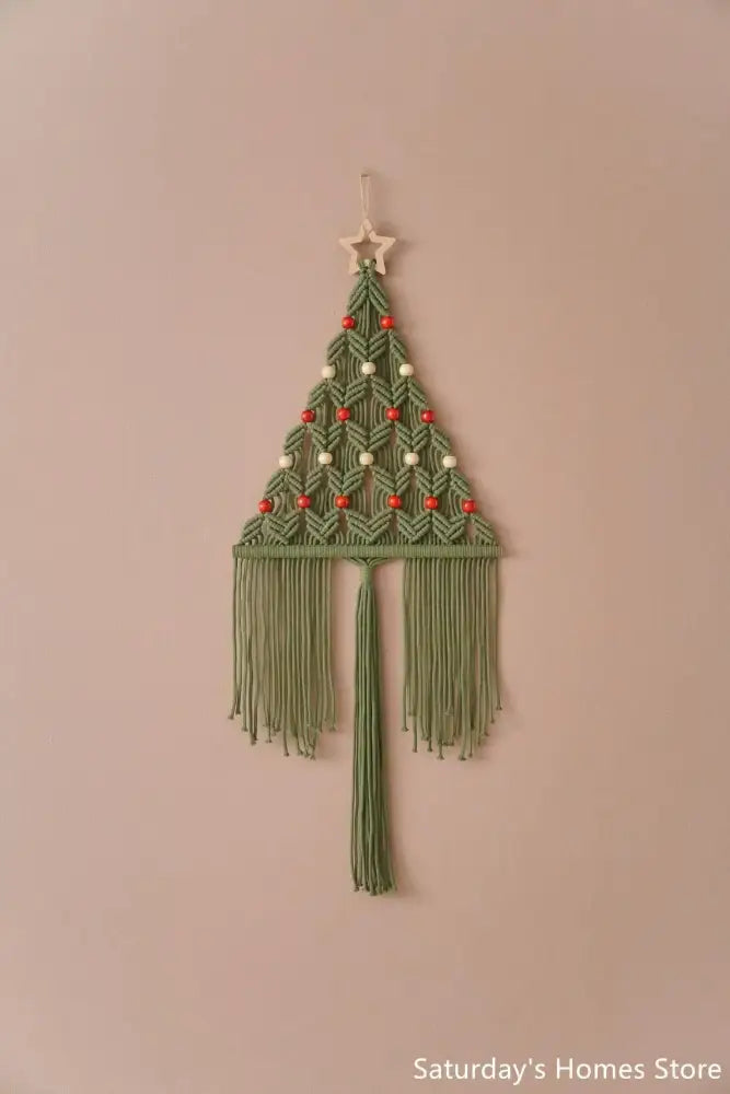 Boho christmas tree macrame wall hanging in sage green and cream with wooden star topper and red white beads decorbites christmas tree