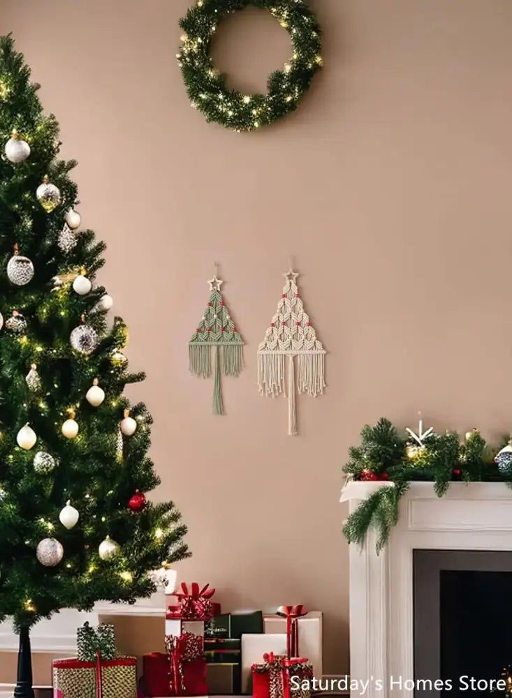 Two boho christmas tree macrame wall hangings in sage green with red accents and cream-colored rope decorbites boho christmas