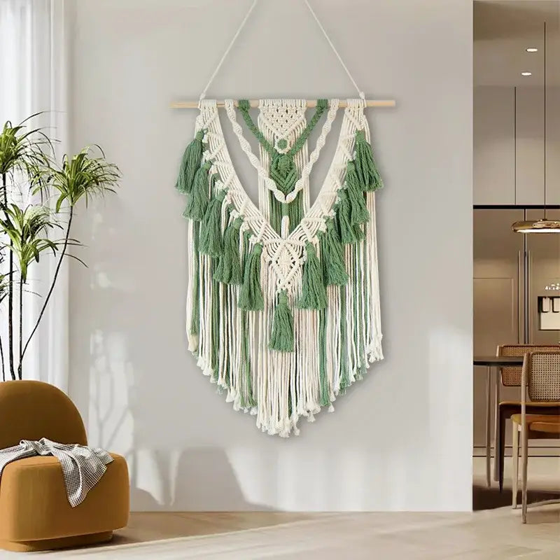 Boho sage green and white wall hanging with intricate macrame tassel stick patterns and matching green macrame tassels