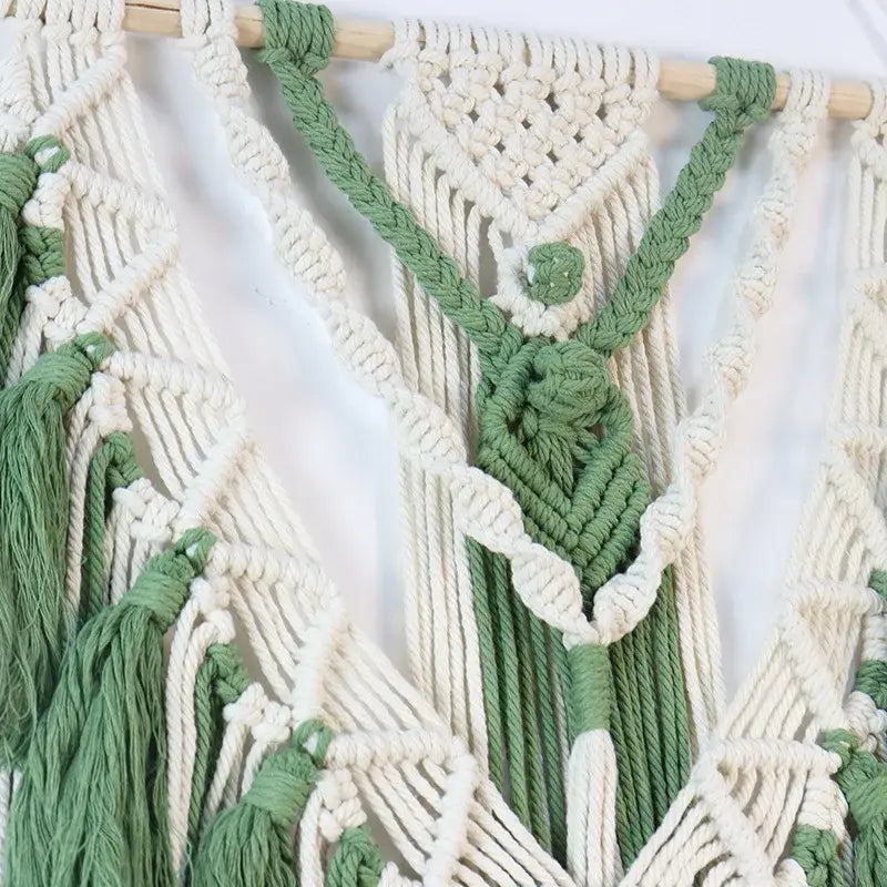 Cream and sage green wall hanging macrame tassel stick with intricate knotwork and wooden dowel for bedroom art