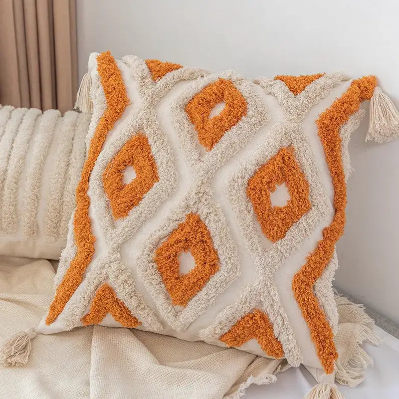 Cream-colored decorbites boho square pillowcase with orange geometric patterns and tassels for living room decor