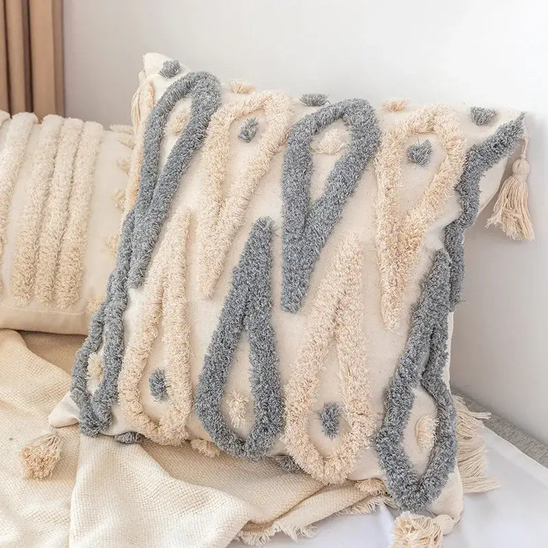 Cream and gray textured decorbites boho square pillowcase with white zigzag and teal tassels for living room decor
