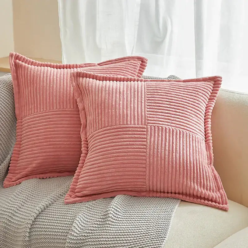 Pink corduroy throw pillows with quilted patchwork design complement boho striped pillow covers for living room decor
