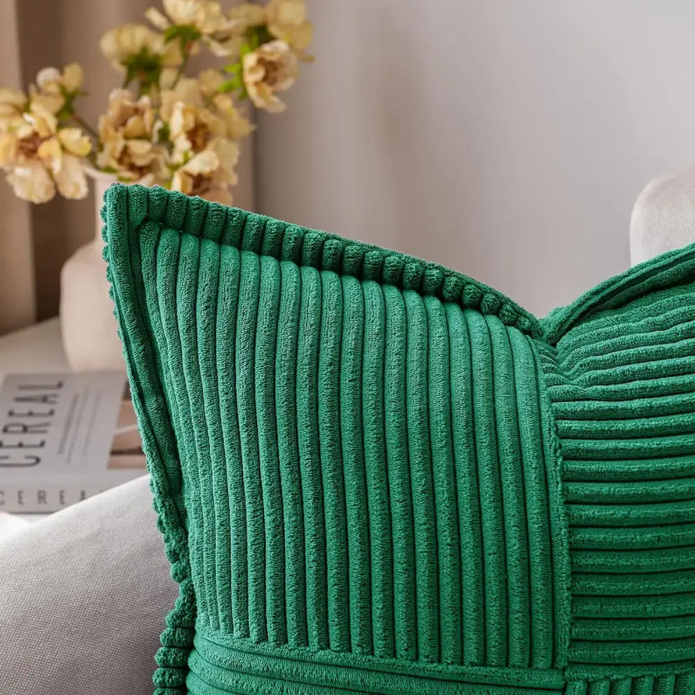 Emerald green corduroy pillow cover with ribbed texture and stitched edges for boho striped pillow decor