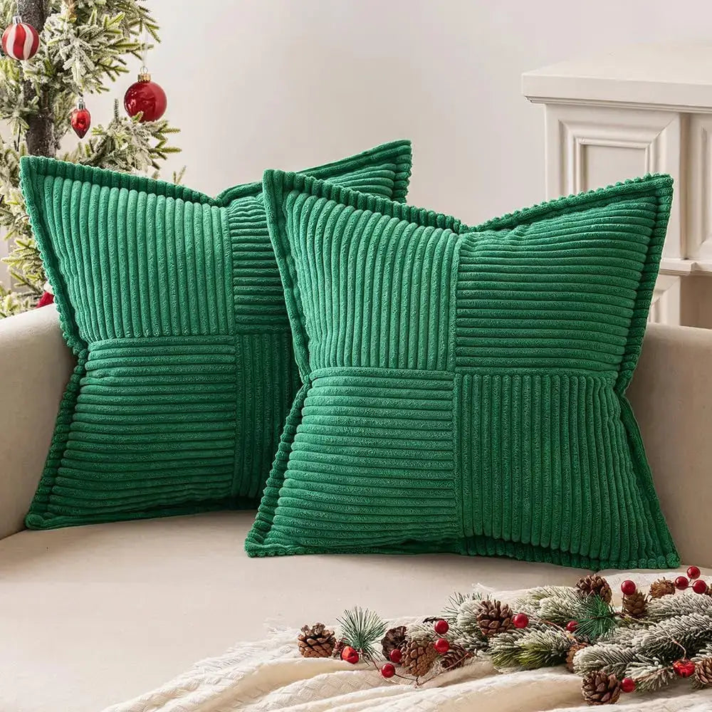 Emerald green corduroy pillow covers with a quilted patchwork design for boho striped pillow decor in living room