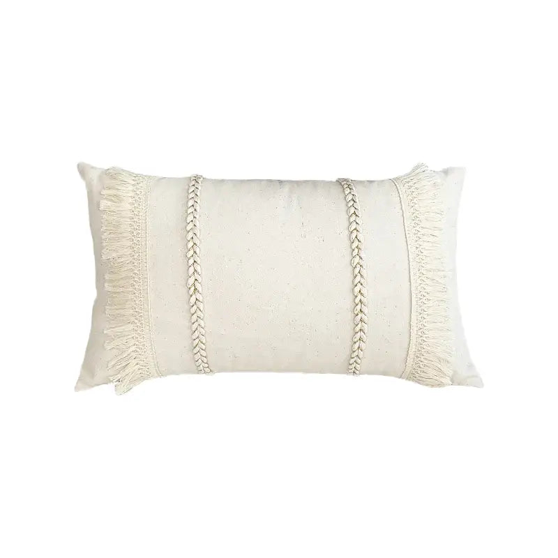 Cream-colored boho style cushion cover with woven braided accents and fringe tassels decorbites boho style living room decor