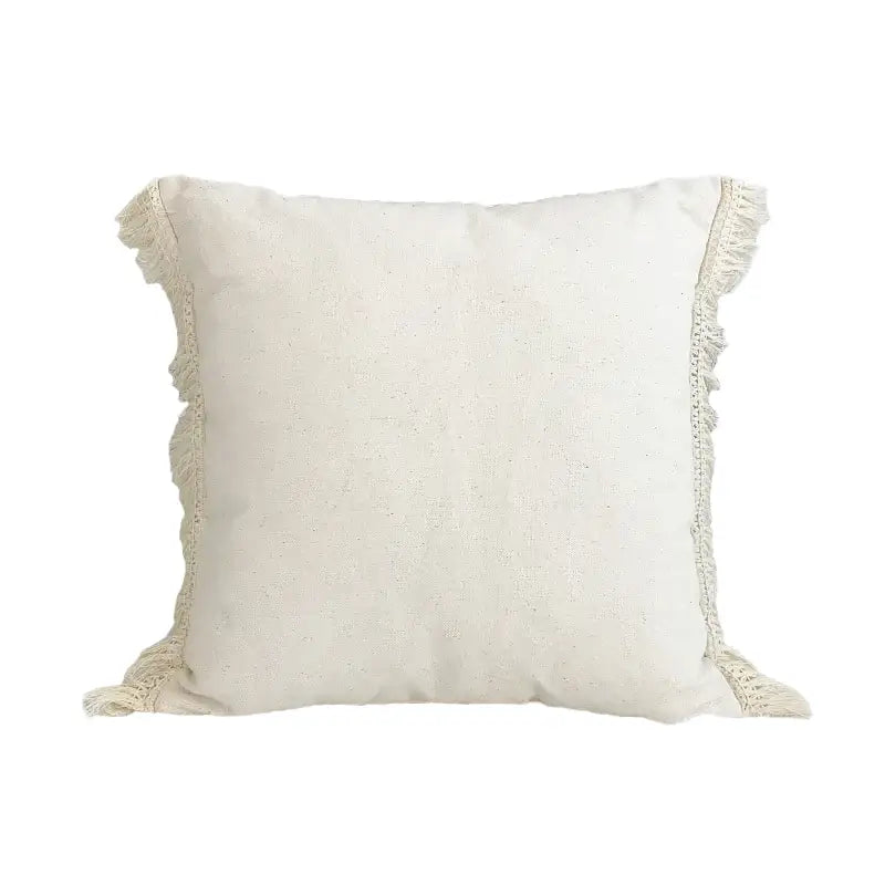 Cream-colored boho style cushion cover with soft linen fabric and delicate fringe tassels for decorbites boho style decor