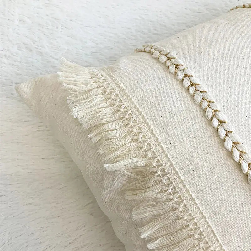 Boho style beige linen cushion cover with cream color, delicate white fringe, and braided embroidery for living room decorbites boho style