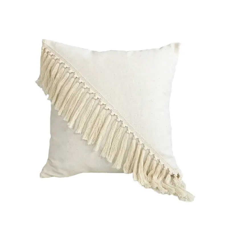 Cream-colored boho style linen cushion cover with diagonal tassel fringe for decorbites boho style living room decor