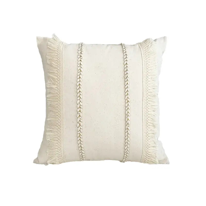 Cream-colored boho style linen cushion cover with textured braided cord and fringe detailing for living room decorbites decor