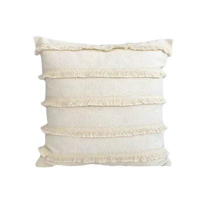Cream-colored boho style linen cushion cover with horizontal frayed stripes and tassels for living room decorbites decor
