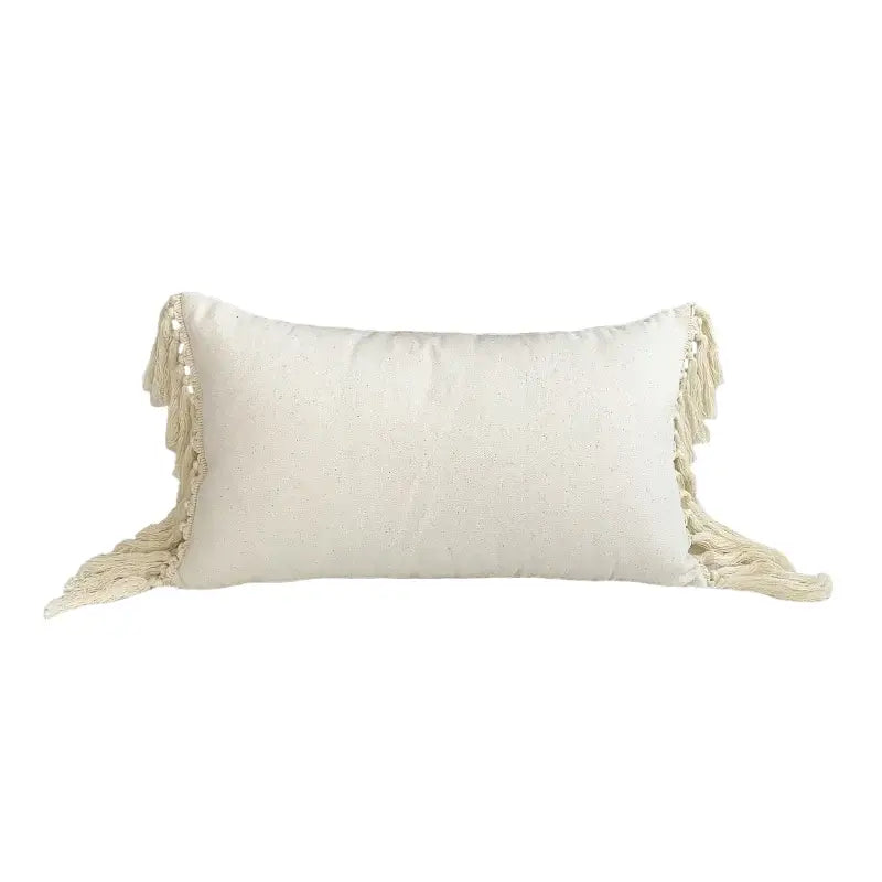 Cream-colored boho style linen cushion cover with textured fabric and tassels for living room decor by DecorBites