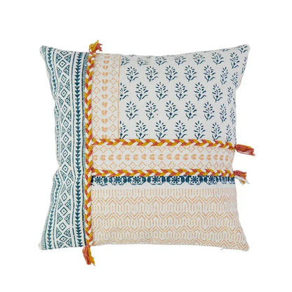 Boho style cotton pillow cover with cream and mustard patchwork, blue botanical prints, and orange braided trim decorbites boho style