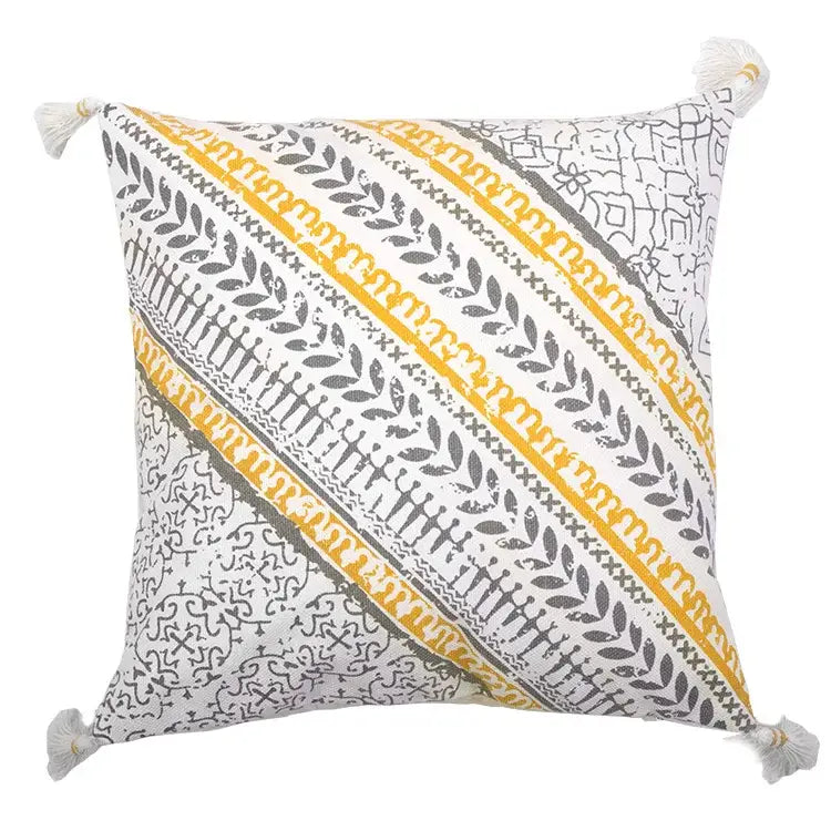 White boho style cotton embroidered pillow cover with mustard yellow and charcoal gray stripes and tassels by decorbites