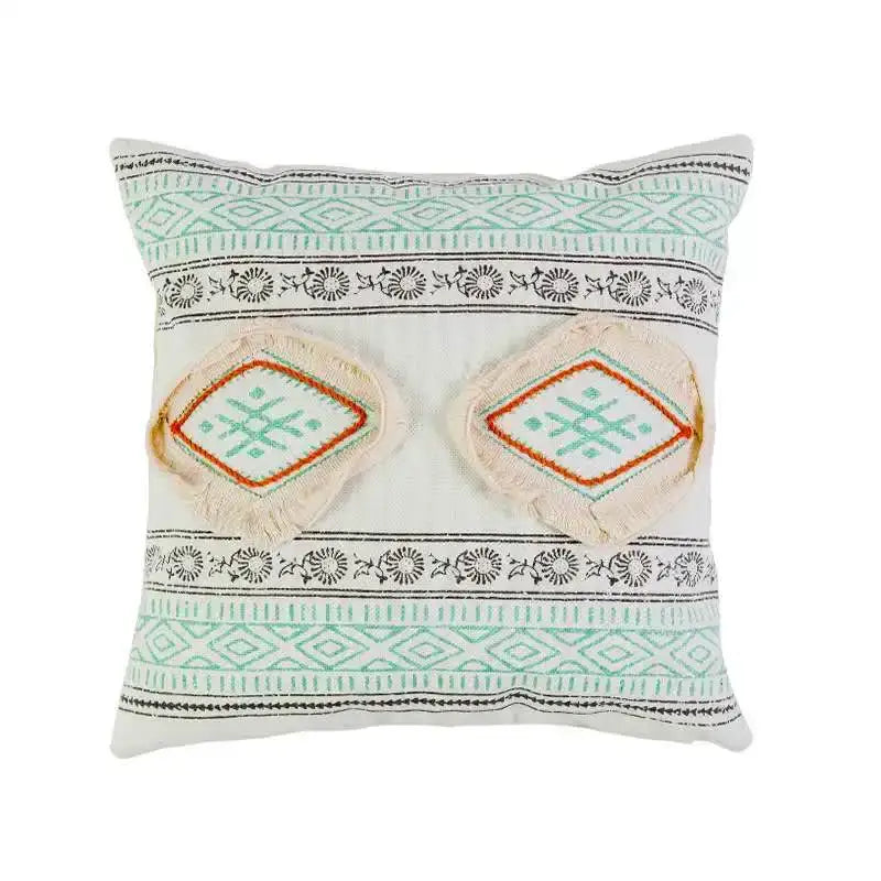Boho style cotton embroidered pillow cover in cream and light mint green with black geometric patterns and frayed edges by decorbites