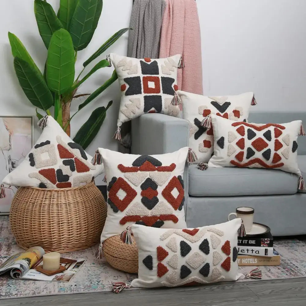 Set of boho style embroidered pillow covers in cream terracotta and charcoal with tassel trim from decorbites for living room decor