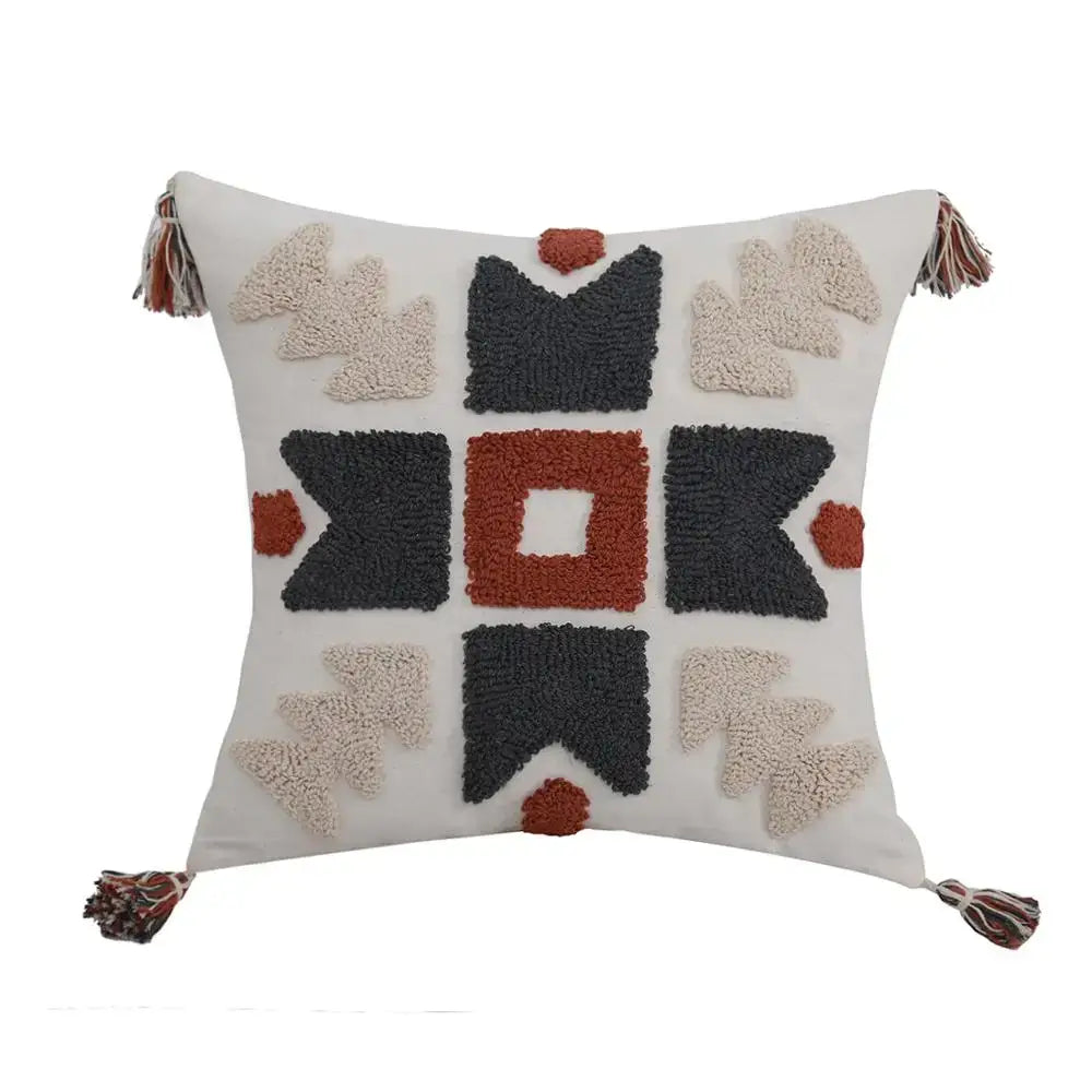 Cream-colored boho style embroidered pillow cover with textured geometric pattern and tassels for decorbites living room decor