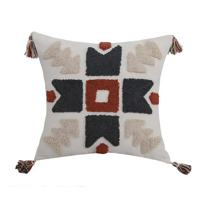 Cream-colored boho style embroidered pillow cover with textured geometric pattern and tassels for decorbites living room decor