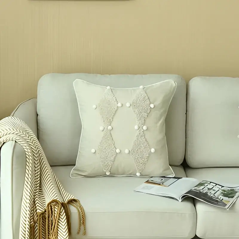 Boho style ivory cushion cover with textured diamond pattern and white pearls for living room decor by decorbites